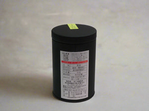 Black cylindrical container with a label on a white background